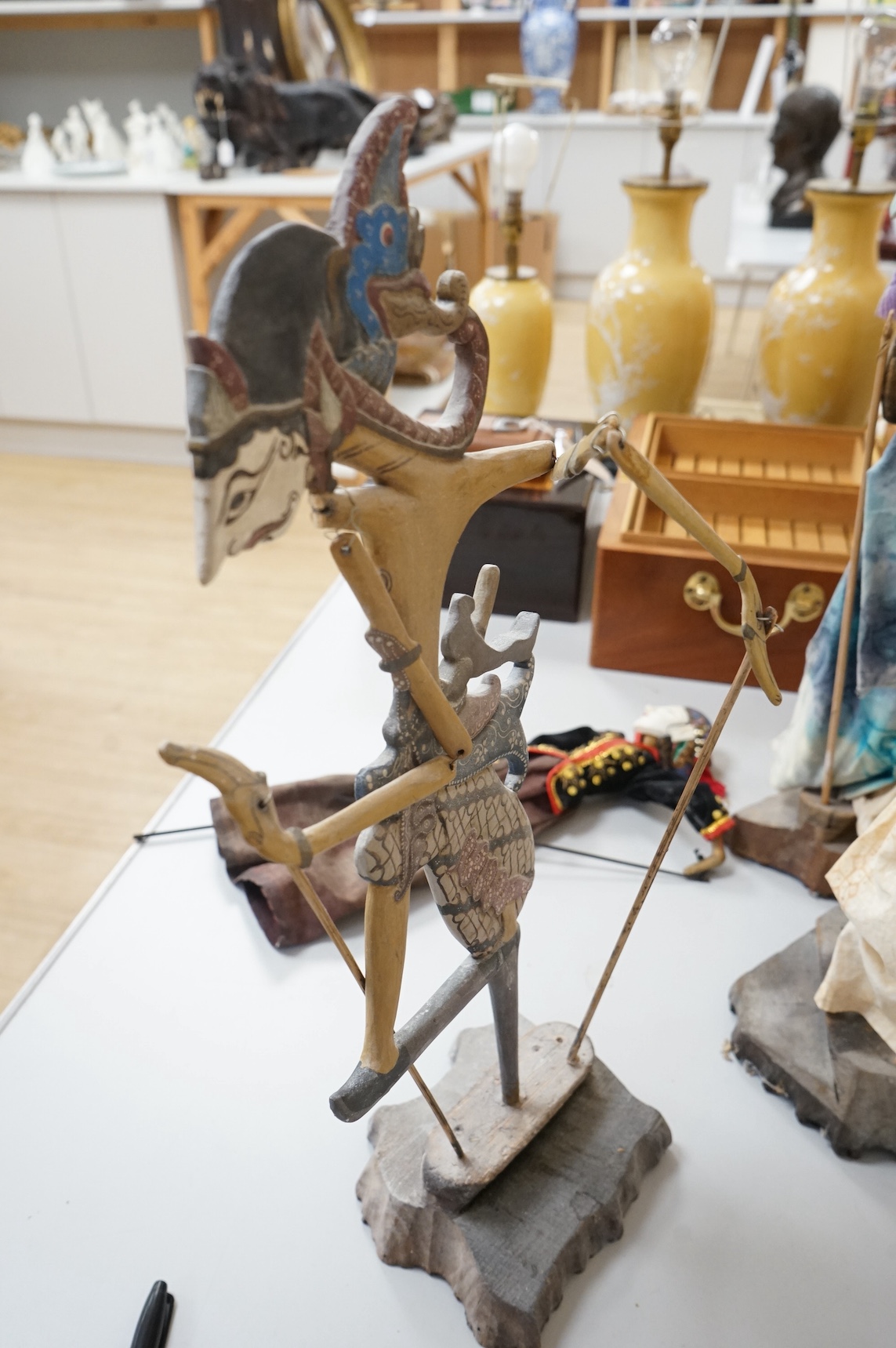 Three Thai carved wooden puppets and similar wooden puppet. Tallest 65cm high. Condition - fair